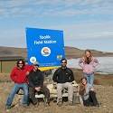 Students pose in front of a Toolik Field Station sign.